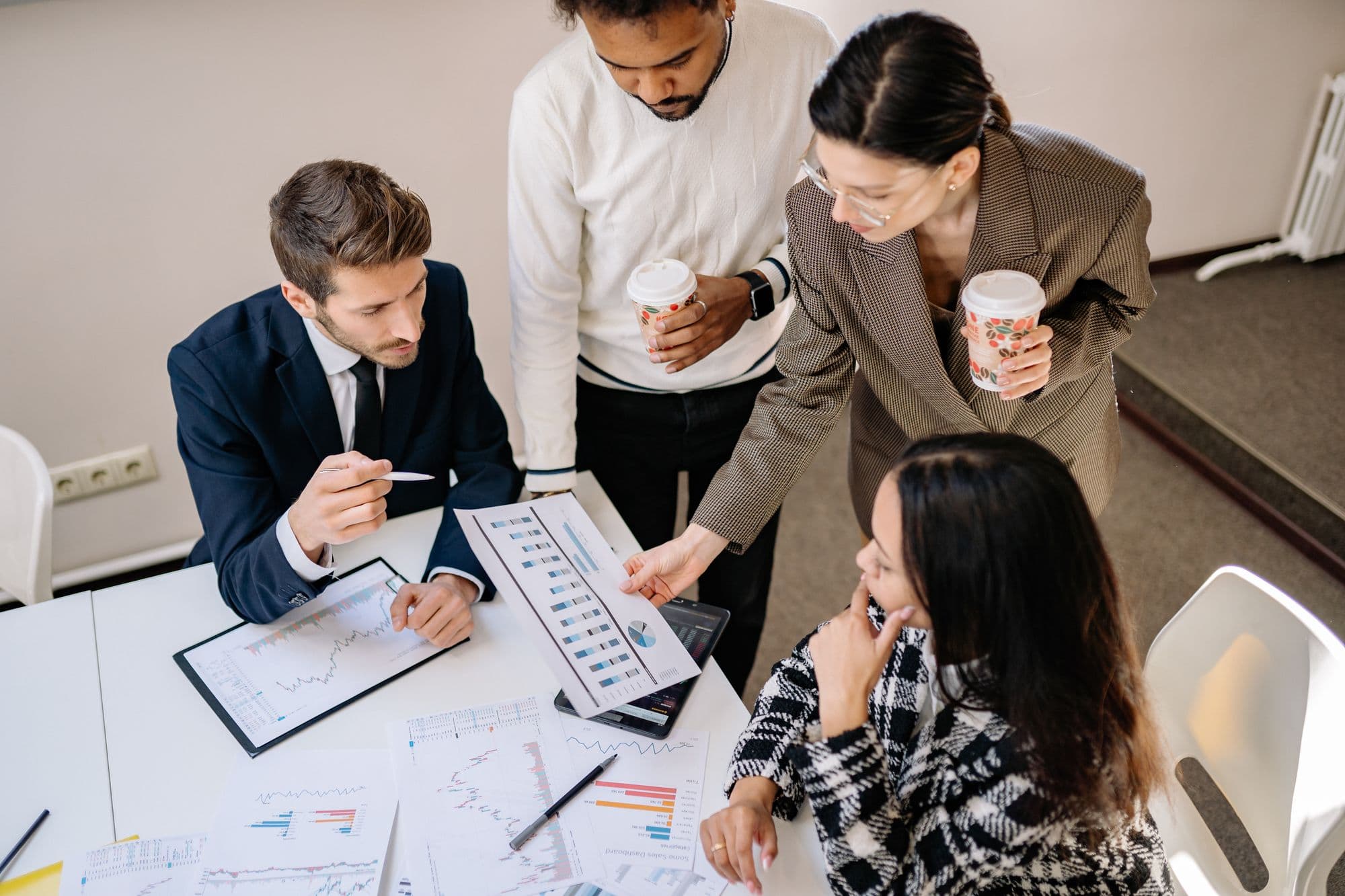 A small accounting team working through documents together